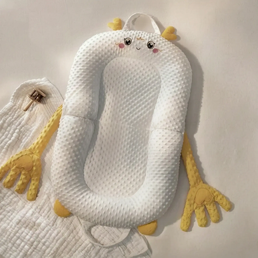 Nido Nubela amarillo con forma de dragoncito, visto desde arriba